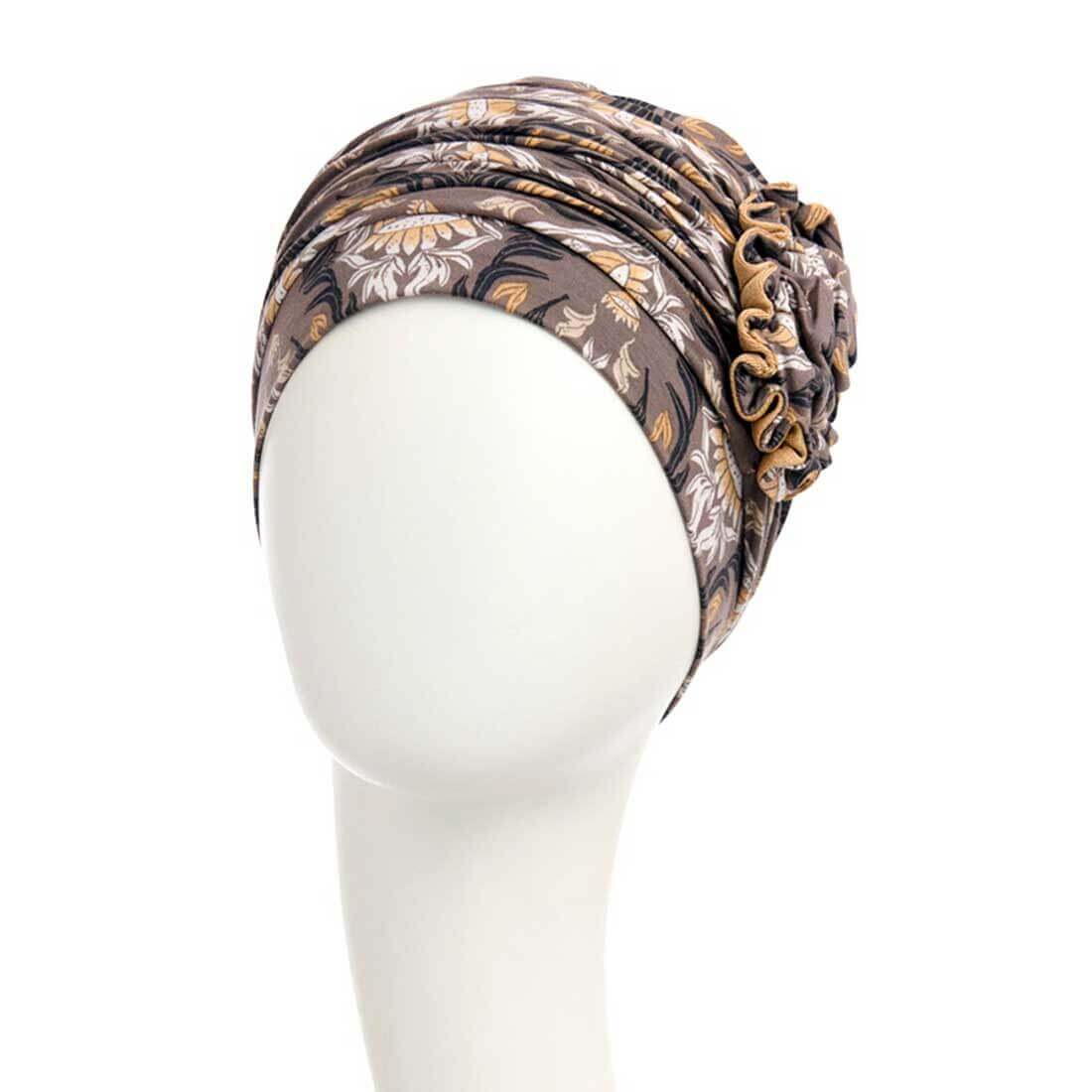 Lotus turban med en smuk roset i fronten, for et feminint look.