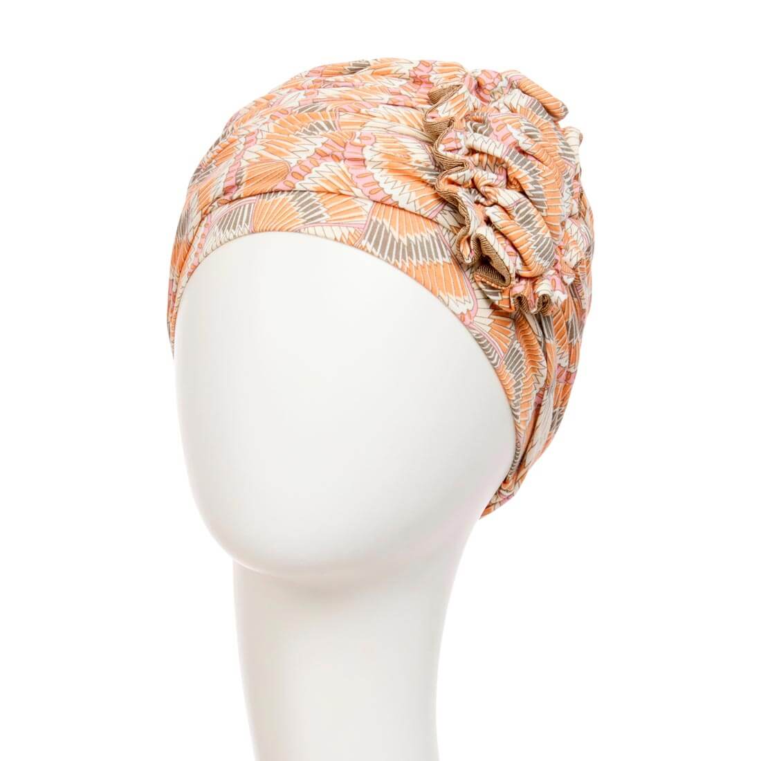 Feminin turban hue med en stor blomst i range farver