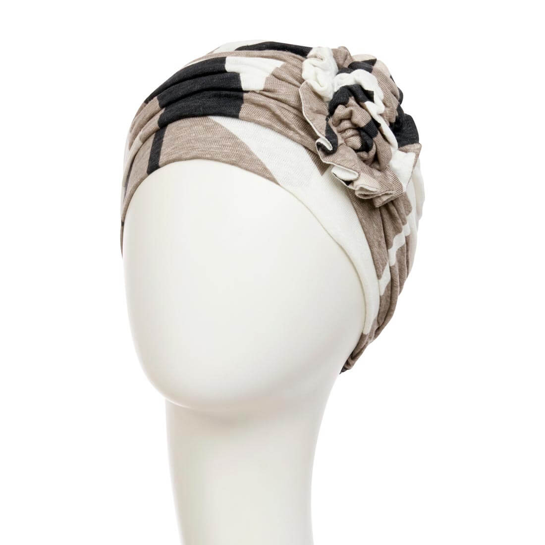 Feminin turban med en blomst foran