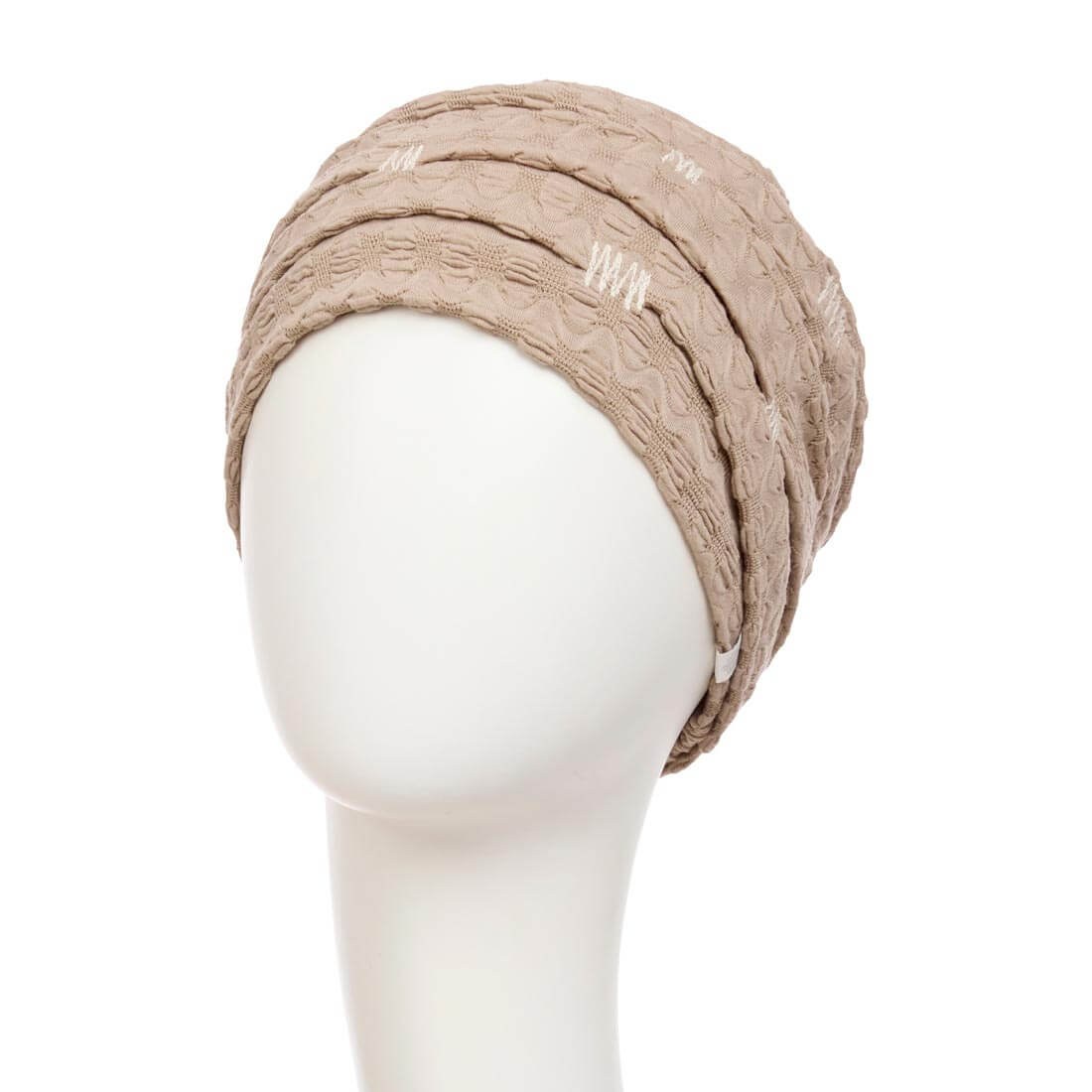 Beige turban i flot mønstret stof