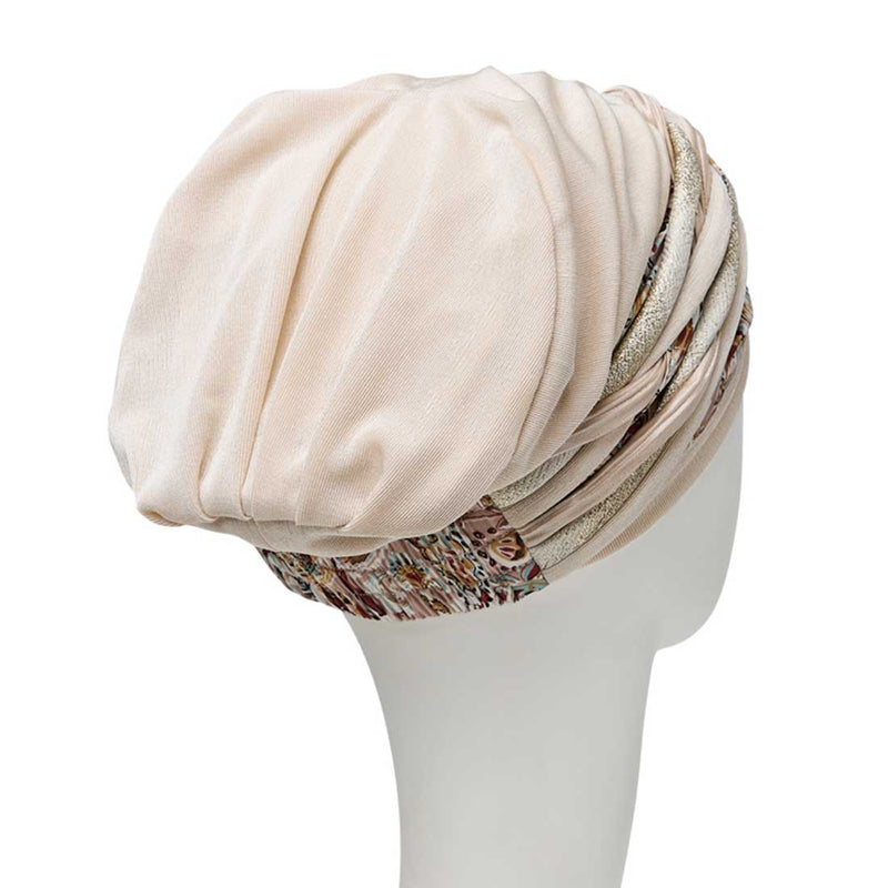 Blød Scarlett turban i en lys farve med et mønstret pandebånd der kan tages af.