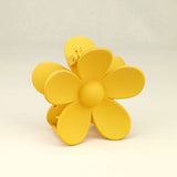 Hårklemme med blomst i gul